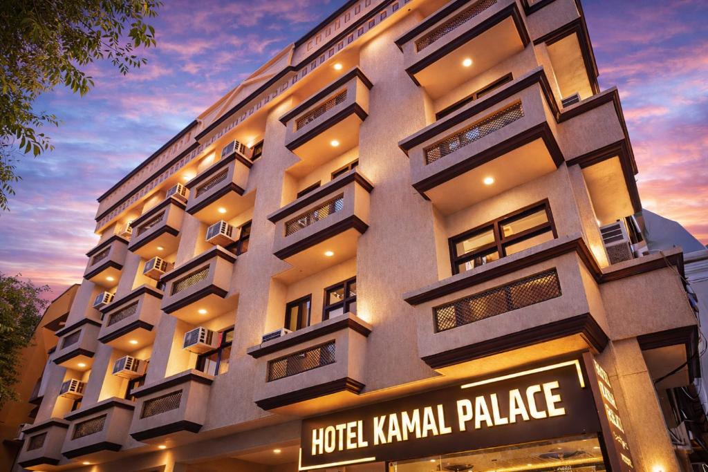 a hotel kovalam palace building with a sign in front at Hotel Kamal Palace in Lucknow
