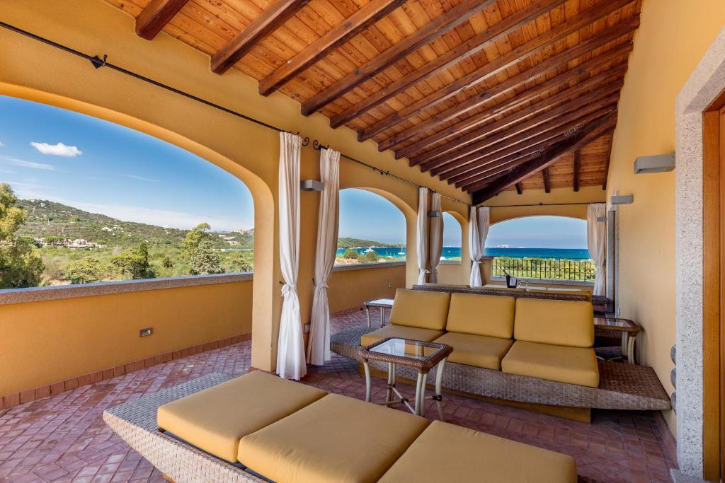 a living room with a couch and a table at Hotel Marana in Golfo Aranci
