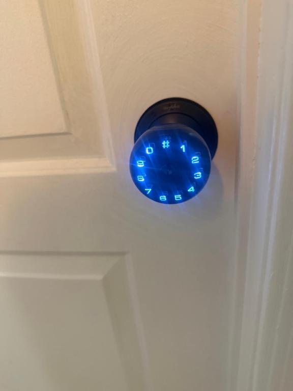 a blue light on the corner of a door at Downtown Taylor Room 4 in Phoenix