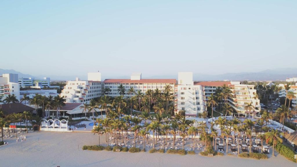 an aerial view of a resort with palm trees and buildings at Occidental Nuevo Vallarta - All Inclusive in Nuevo Vallarta