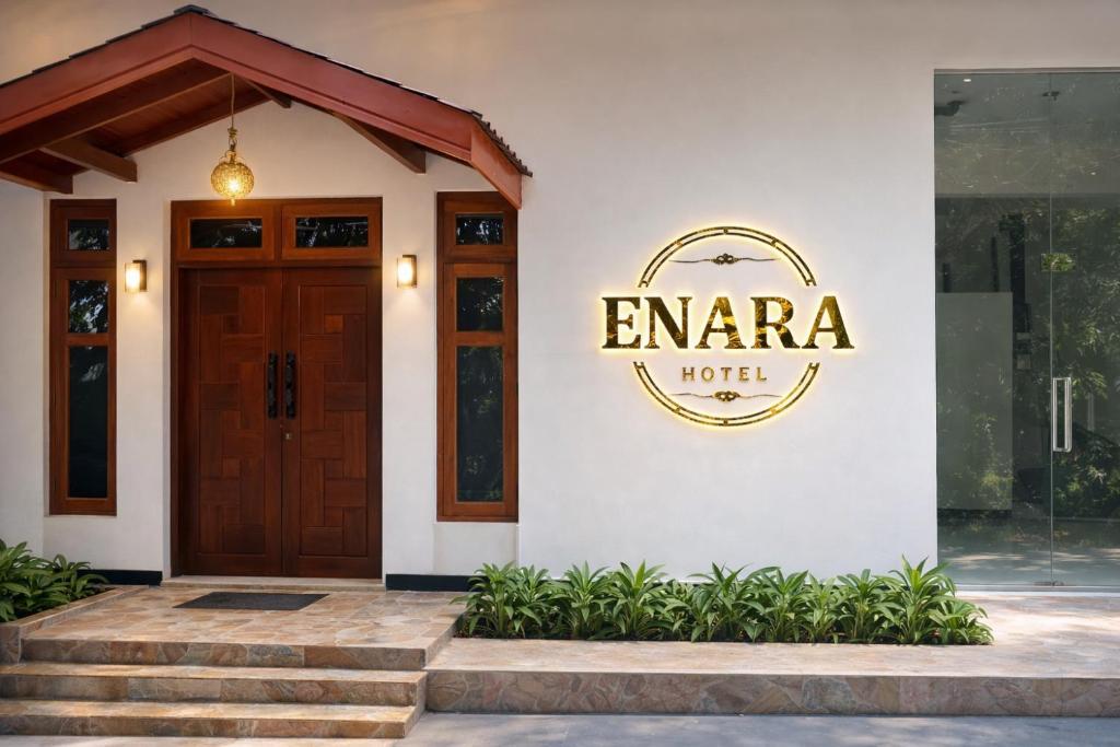 a building with a door and a sign on it at Enara Luxury Stay in Katugastota