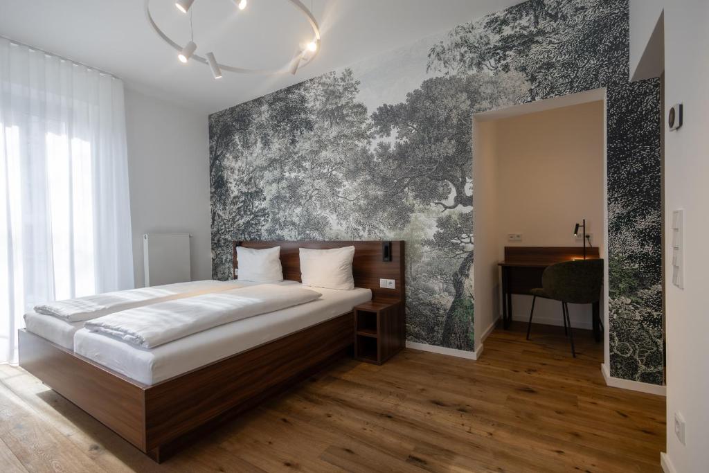 a bedroom with a bed and a wall with a piano at Palazzo Hotel in Mannheim