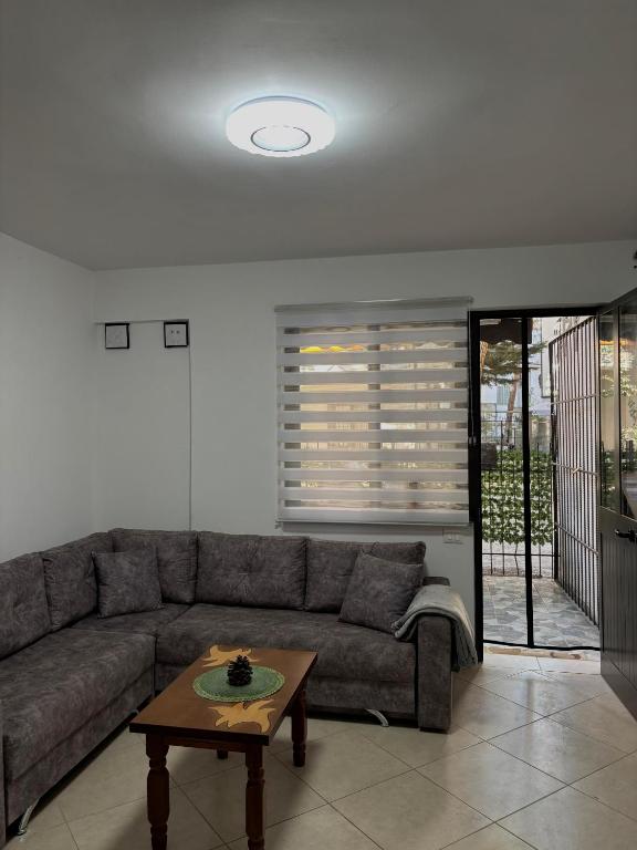 a living room with a couch and a coffee table at SeaStep Apartment Golem in Golem