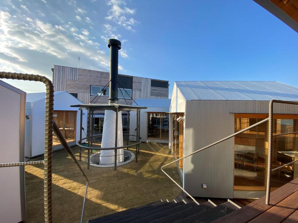 a house with a solarium on the roof at Inn Azur in Yamatotakada