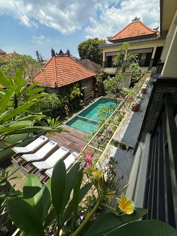 an external view of a resort with a swimming pool at Ariartha homestay in Ubud