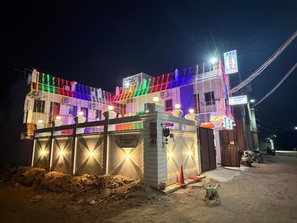 a building with christmas lights on it at night at Gravity Groups VVJ - Near Jipmer Sangamithra in Pondicherry