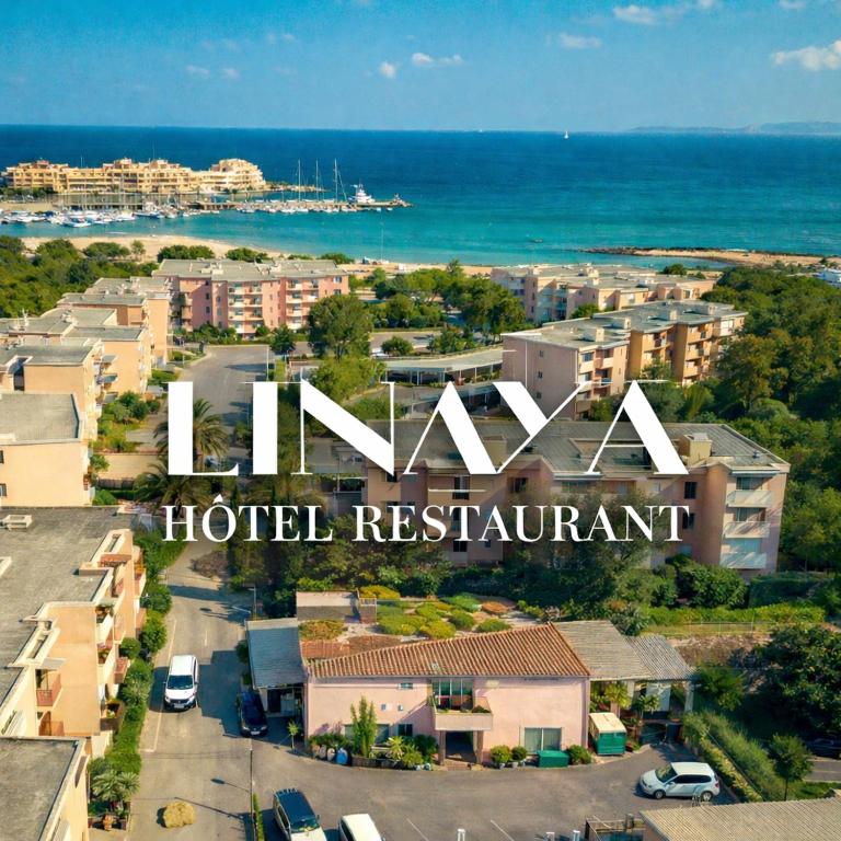 a sign for a hotel restaurant in a city at Linaya Hôtel & Restaurant in Bormes-les-Mimosas
