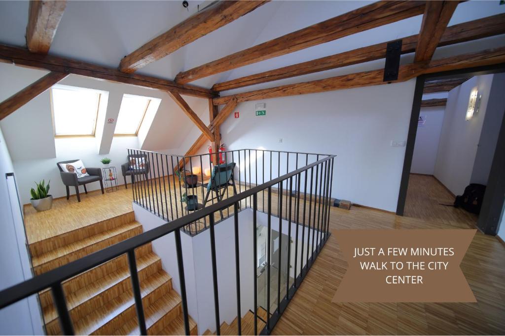 an overhead view of a living room with wooden beams at AMS Rooms in Ljubljana