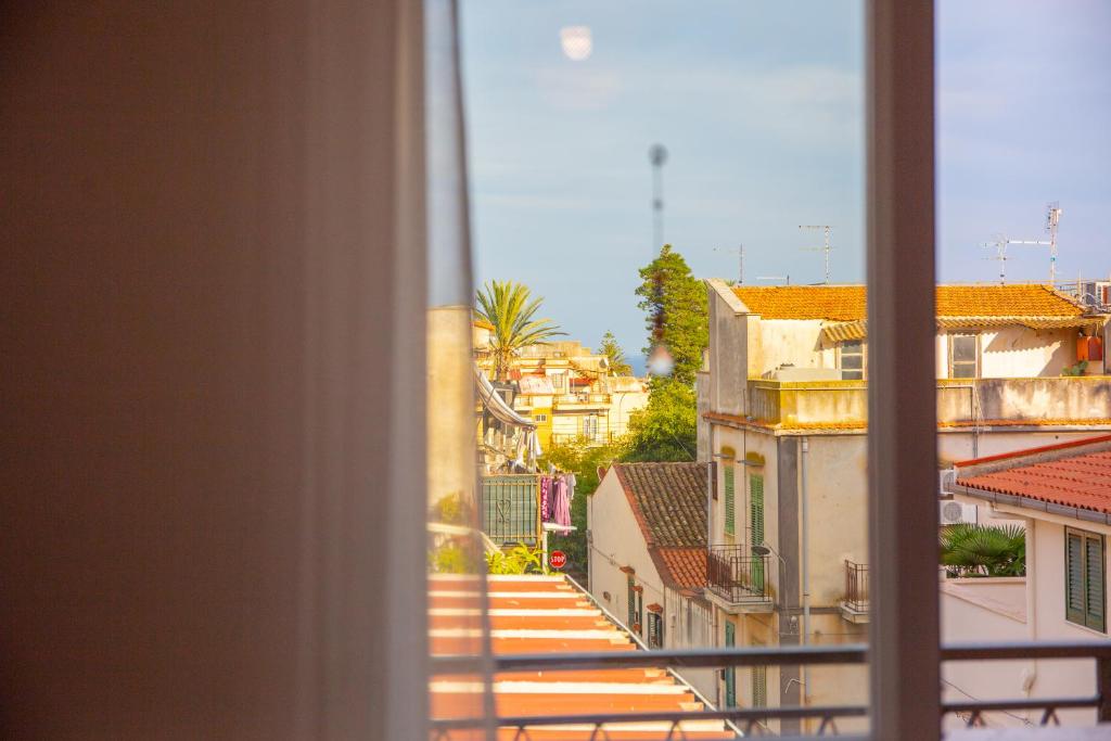 a view of a city from a window at Solemar Sicilia - Casa Minerva in Santa Flavia