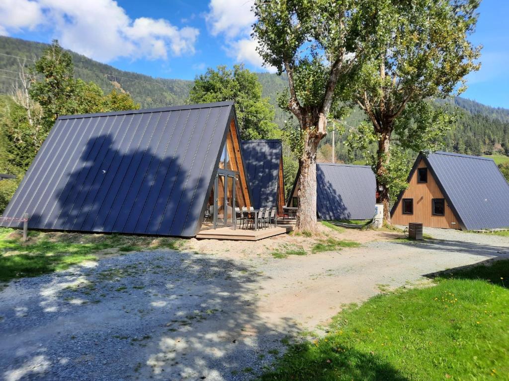 an image of a house with a metal roof at Parc Sonnleiten - A Chalet in Gnesau