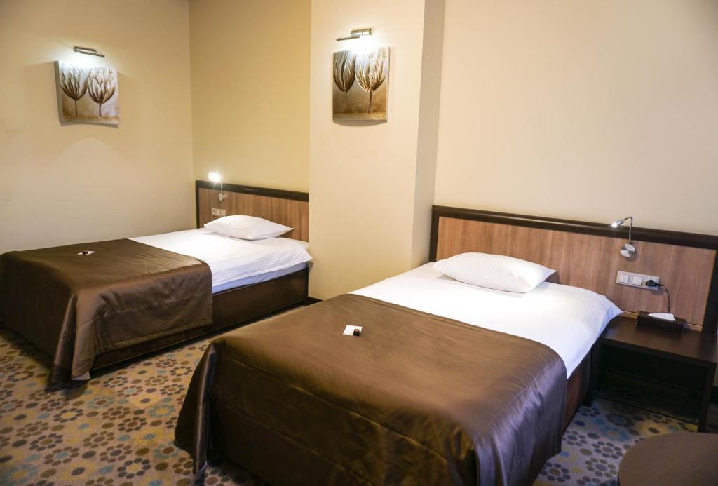 Postel nebo postele na pokoji v ubytování Park-Hotel Golosievo