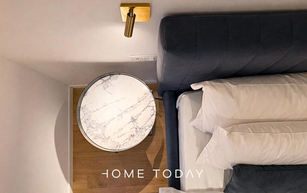 a mirror on a wall next to two beds at HT - Luxury suite in Piazza del Santo in Padova