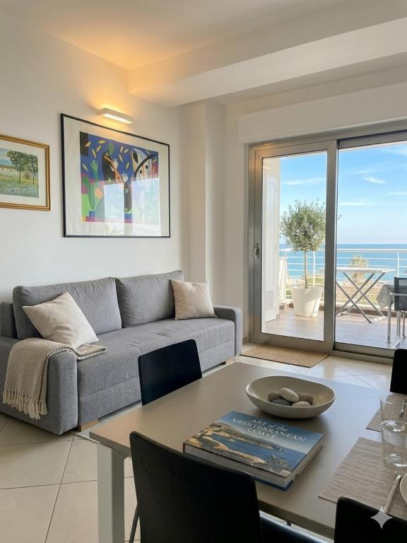 a living room with a couch and a table at RIVIERA PALACE - BILO SEA FRONT- Premium Villas in Giulianova