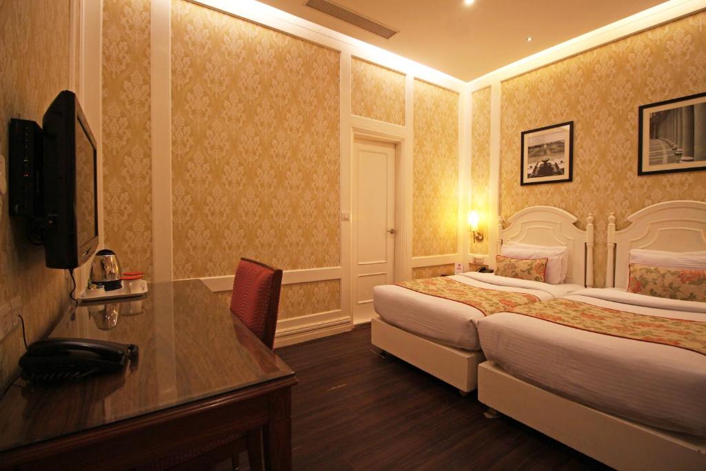 Postel nebo postele na pokoji v ubytování Hotel Bright