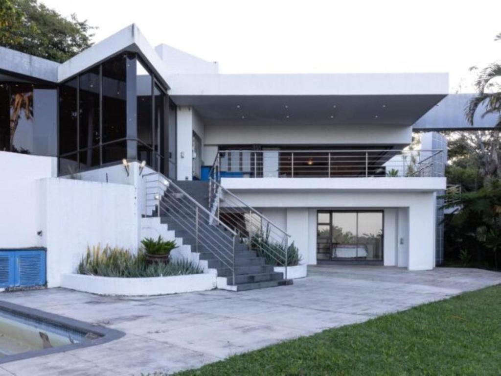a house with a staircase in front of it at Villa Aurora in Margate