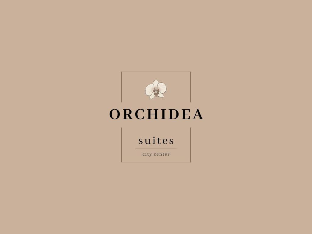 a logo for a spa with a flower on it at Orchidea suites - City center in Bari