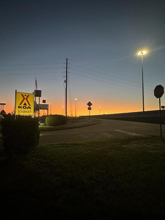 a road with a sign on the side of it at Texarkana KOA Journey in Texarkana