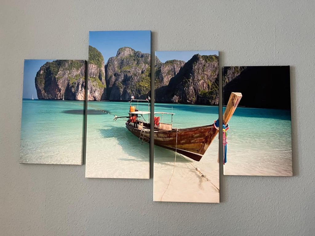 a boat on the beach piece canvas painting at Very nice, Central and fully Furnished Apartment in Bonn
