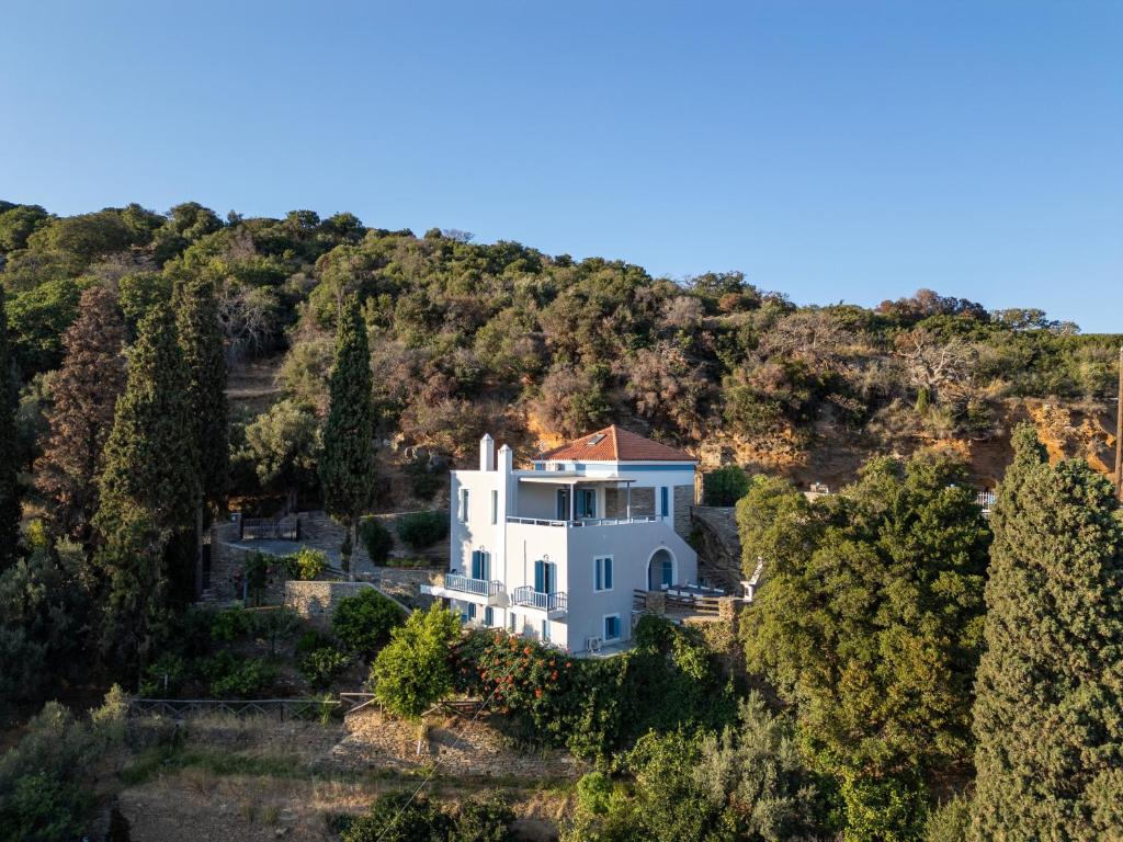 an aerial view of a white house in a forest at villa eirini in Kourélion