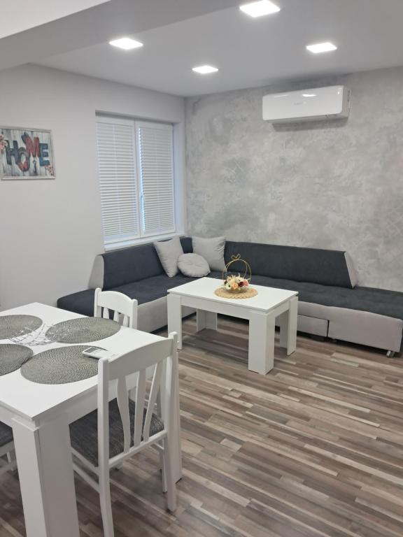 a living room with a couch and a table at Apartment Petrovi in Lovech