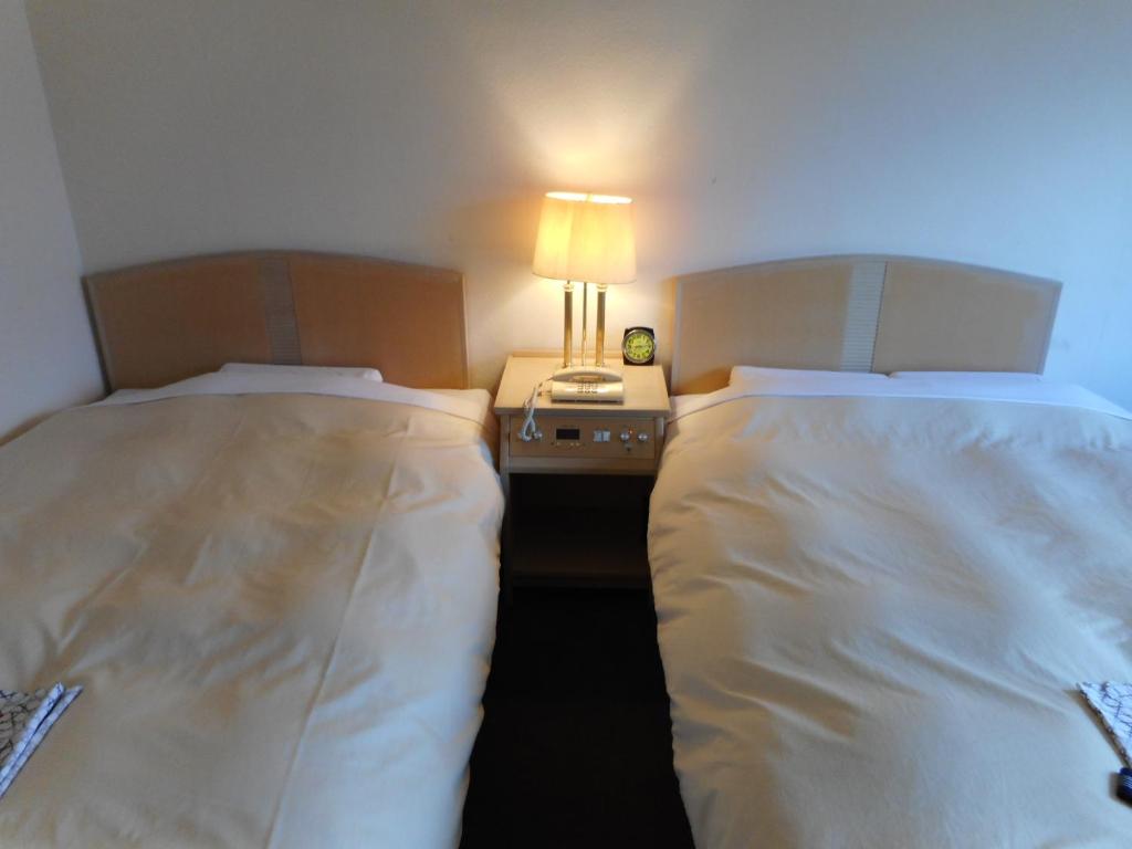 Postelja oz. postelje v sobi nastanitve Breezbay Lake Resort Kawaguchiko
