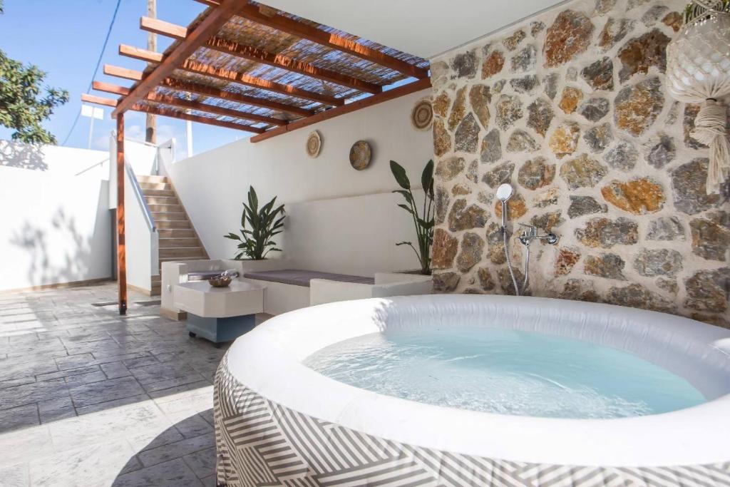a hot tub in the middle of a patio at Casa Gemma 3 in Rhodes Town