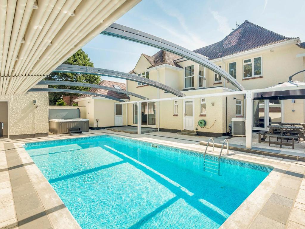 a swimming pool in the backyard of a house at Seacroft Lodge in Skegness