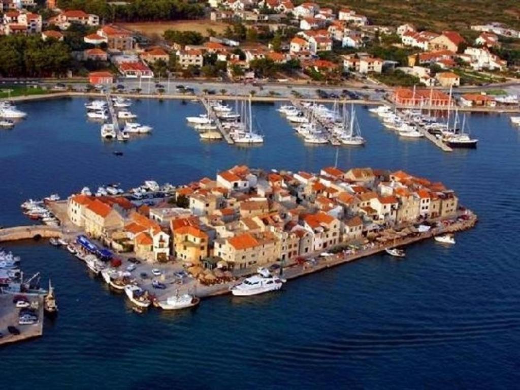 an aerial view of a harbor with boats in the water at MareVita in Tribunj