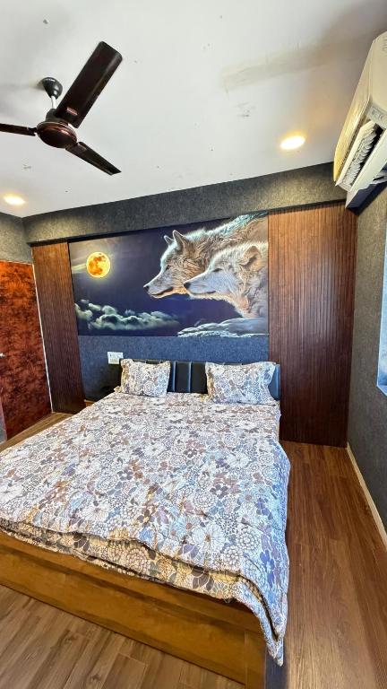 a bedroom with a wolf mural on the wall at 7 Star Hotel in Surat