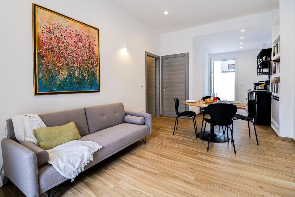 a living room with a couch and a table at Umberto I by Casa di Marco in Sannicola