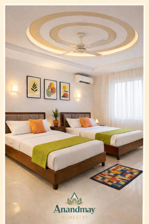 two beds in a room with a ceiling at Anandmay Homestay, Near Triveni Ghat, Rishikesh in Rishīkesh