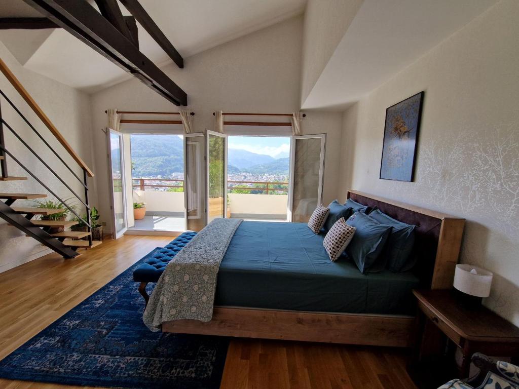 a bedroom with a bed and a large window at Omah Jawa in Lourdes