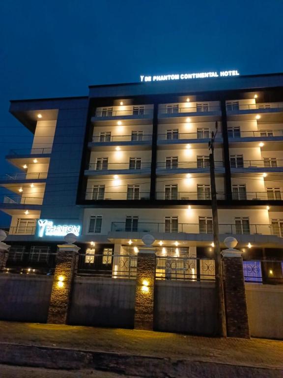 a large building with lights on it at night at Dephantom Continental Hotel in Lagos