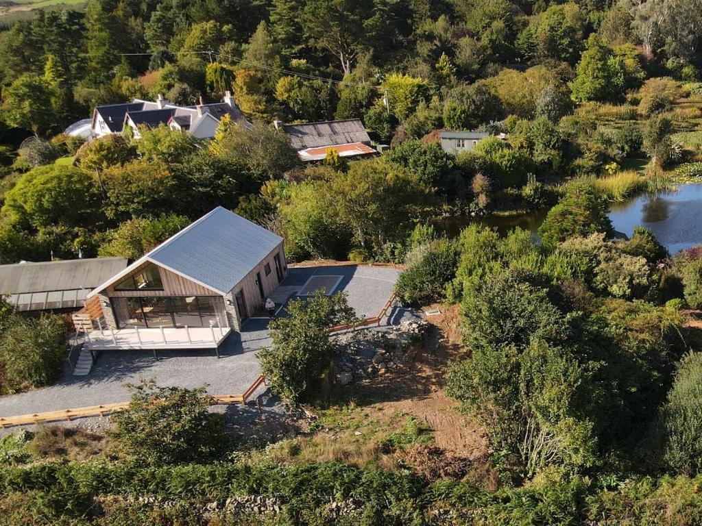 an aerial view of a house with a lake at The Lodge in Stranraer