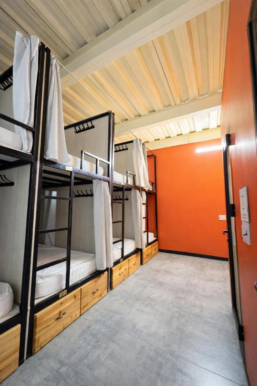 a group of bunk beds in a room at Brotherhood Loop Hostel Station in Làng Lap