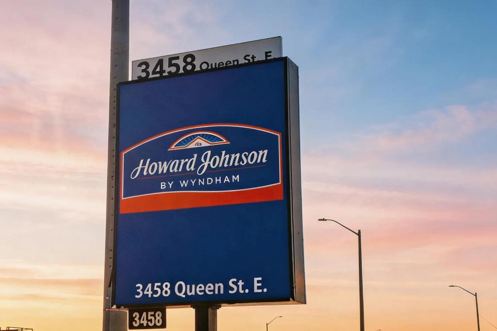 a sign for a diamond gallinosity gas station at Howard Johnson by Wyndham Brampton in Brampton