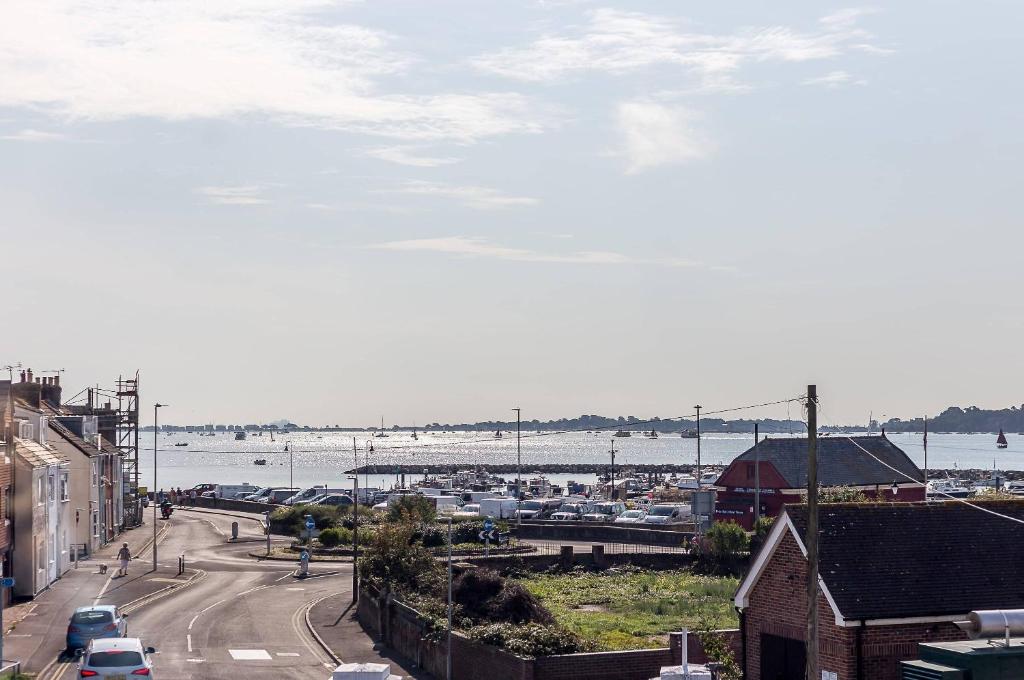 a view of a city with a harbor and a street at Reel Time - Beautiful Townhouse a Stone's Throw from Poole Quay in Poole