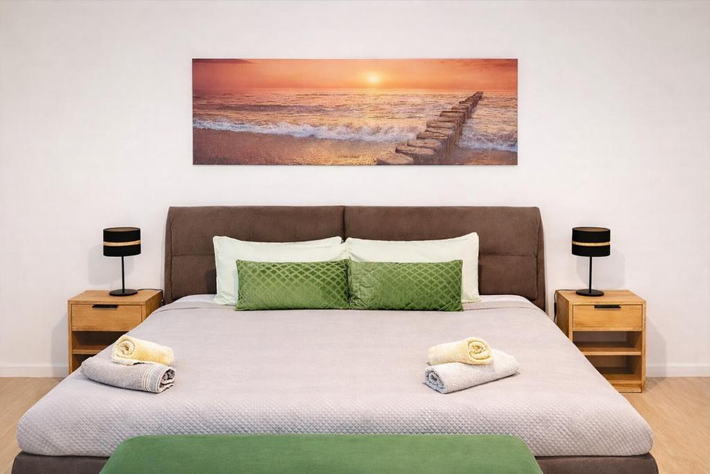 a bedroom with a large bed with two night stands at Cascais Ocean Apartment in Cascais