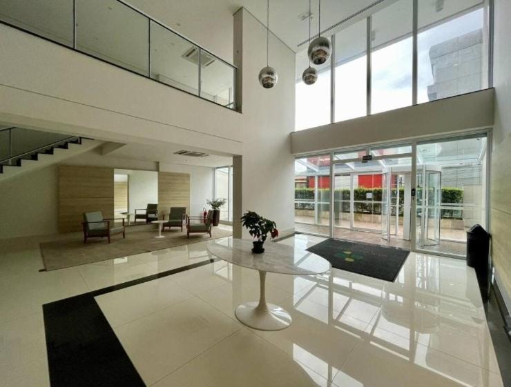 a large living room with a table and chairs at Prime Stay 2102 in Guarulhos