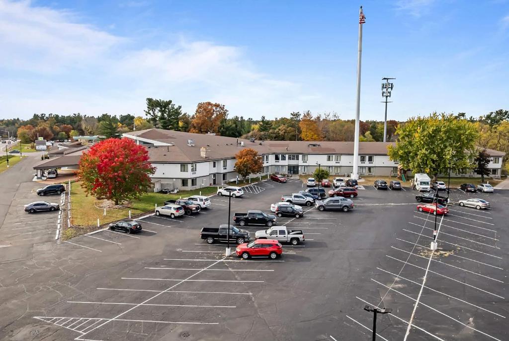 an aerial view of a parking lot with cars parked at Ramada by Wyndham Stevens Point in Stevens Point