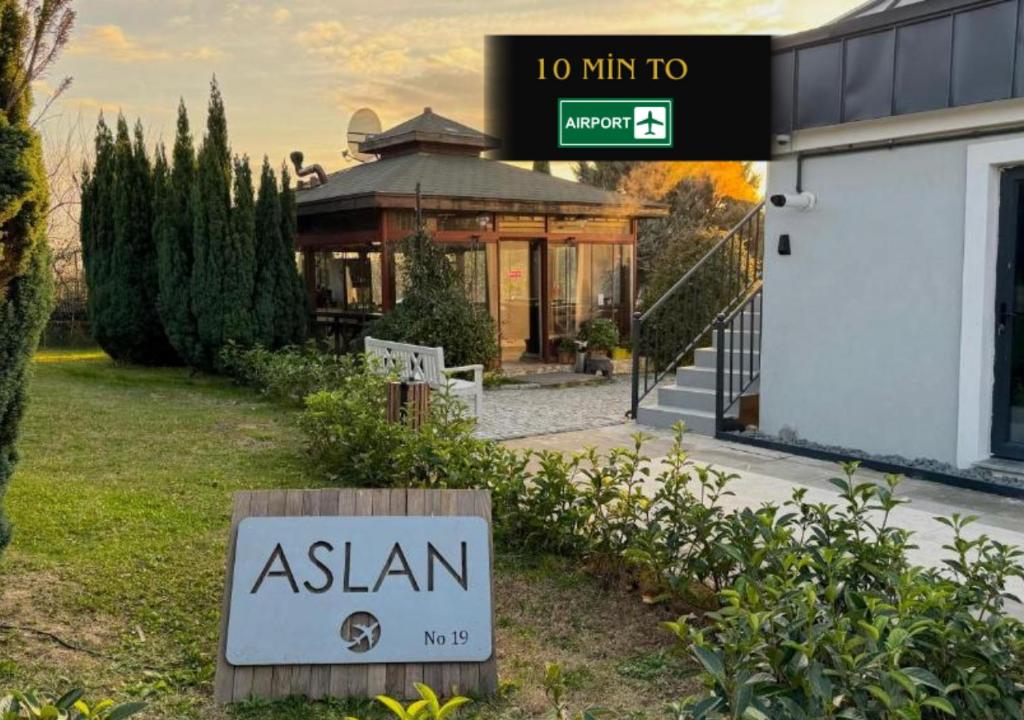 a sign that reads asian in front of a building at ASLAN AİRPORT Hotel in Arnavutköy