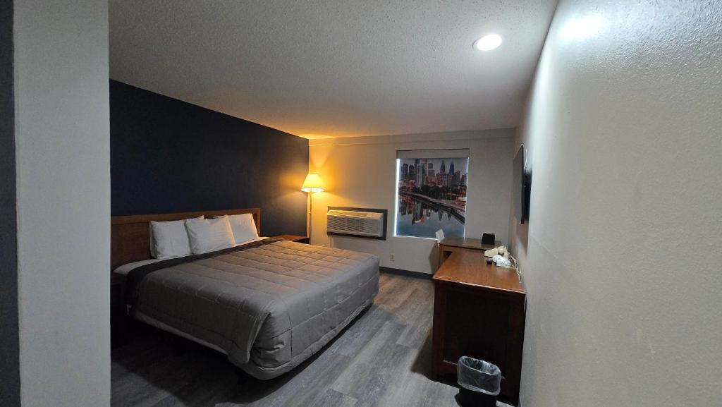 a hotel room with a bed and a desk at Roosevelt Inn at Roosevelt Blvd, Philadelphia, PA in Philadelphia