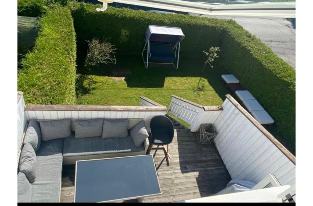 an aerial view of a patio with a couch and a table at Oslo in Oslo