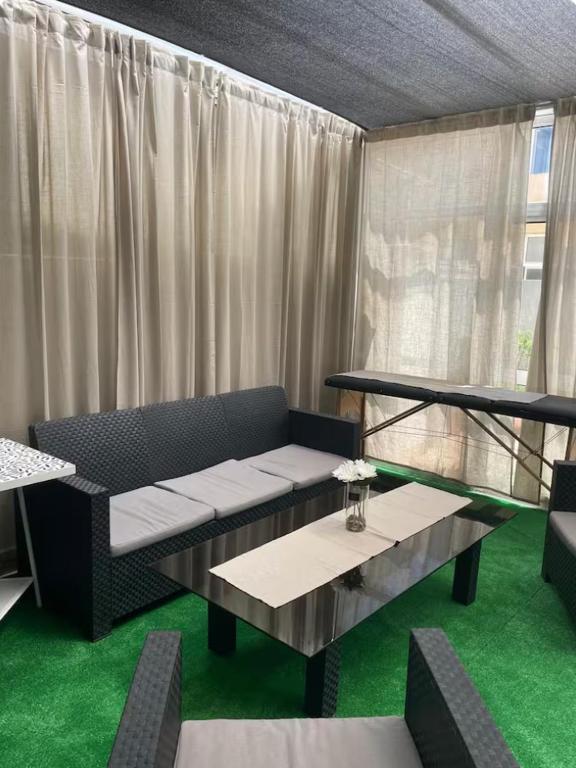a living room with a couch and a table at CasaMaria in Vila do Conde