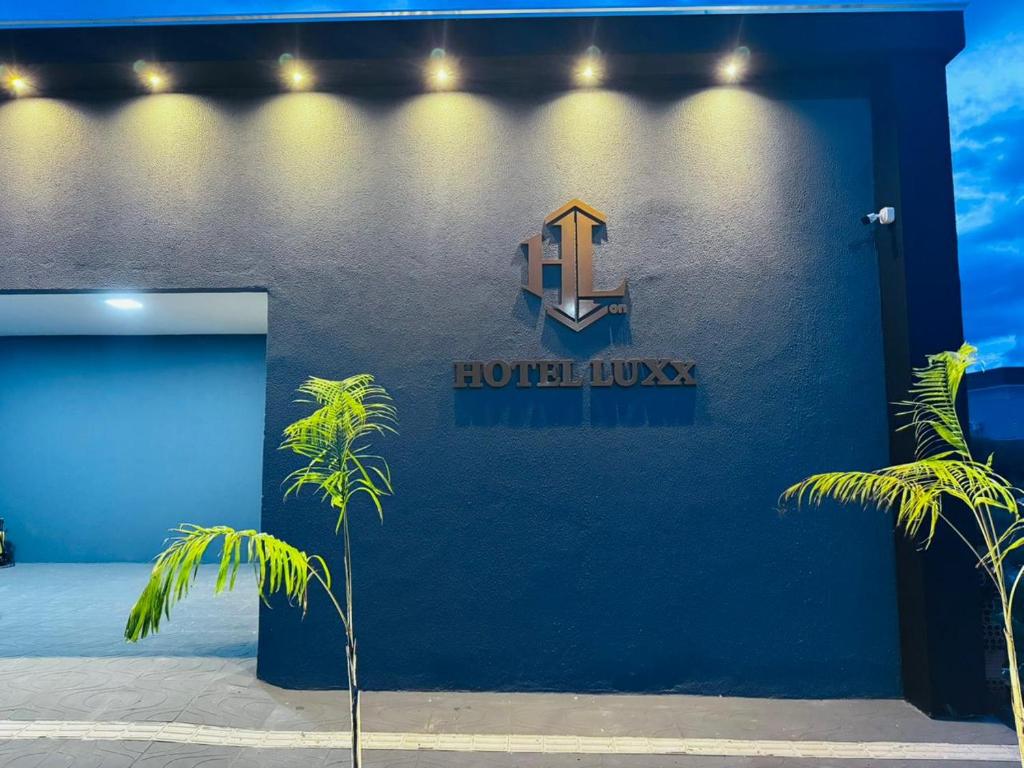 a blue building with a sign on the side of it at Hotel Luxx in Sinop