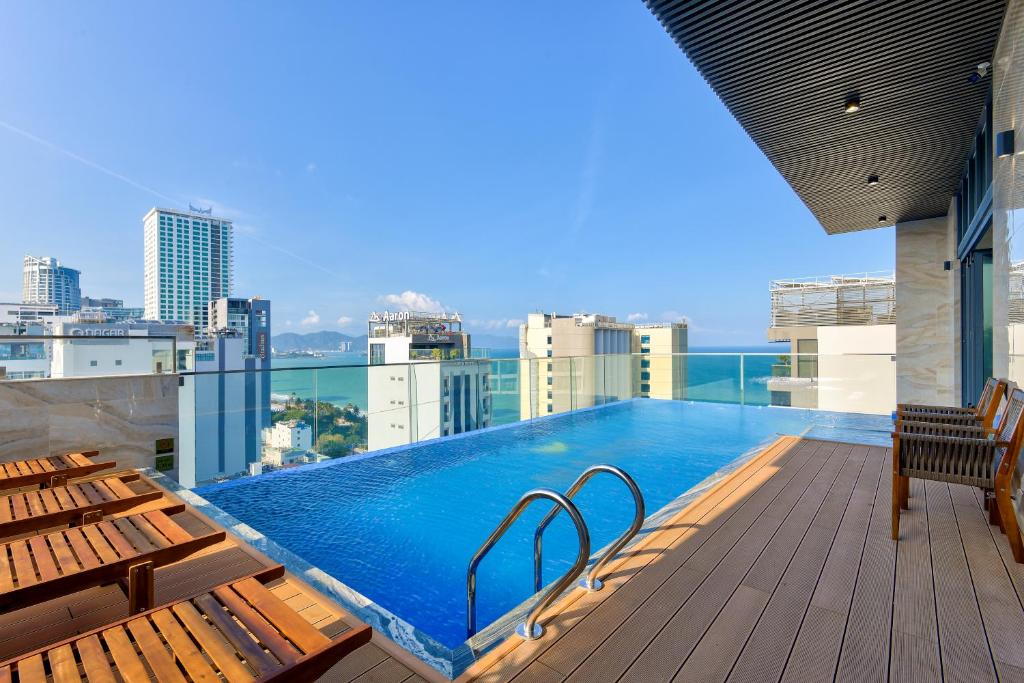 a swimming pool on the roof of a building at Maris Hotel Nha Trang in Nha Trang