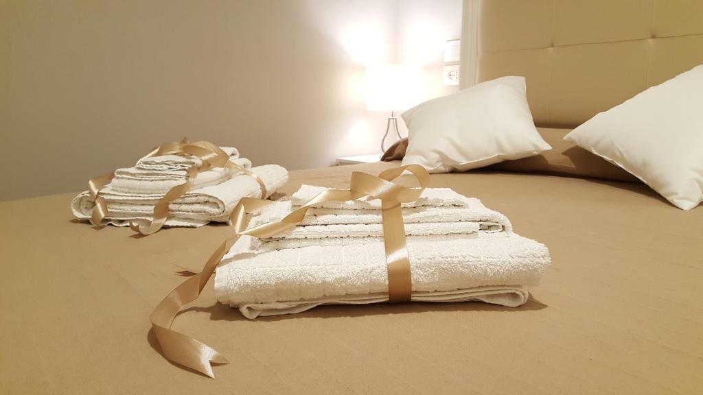 Una cama o camas en una habitación de Scala Suite