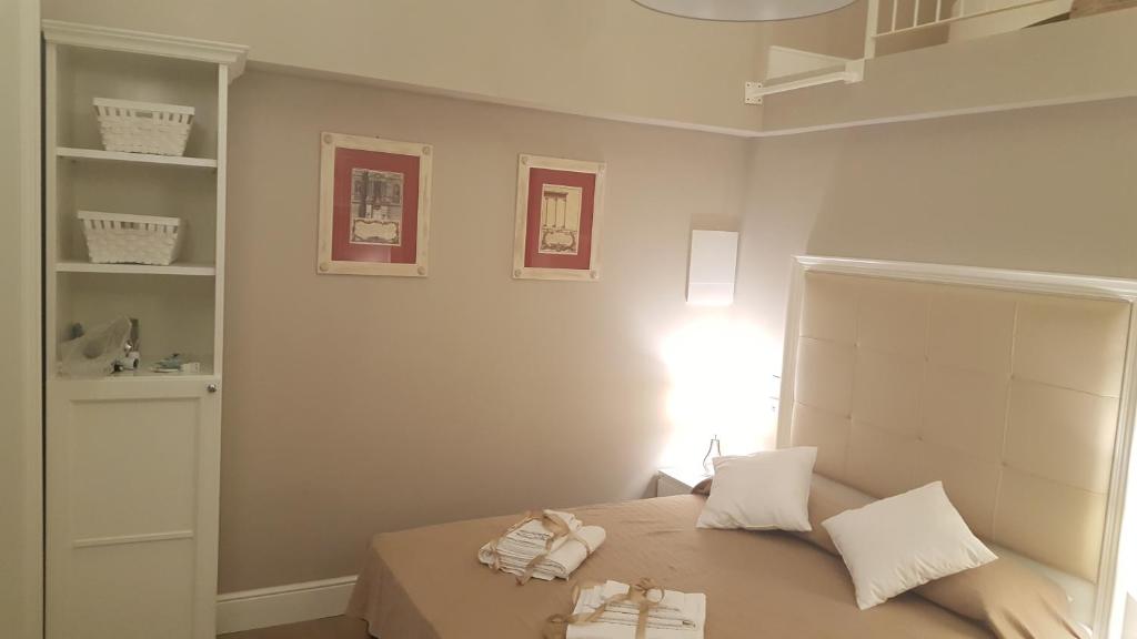 Una cama o camas en una habitación de Scala Suite