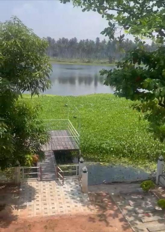 a view of a lake with a dock at Sedna hotel in Mahawewa