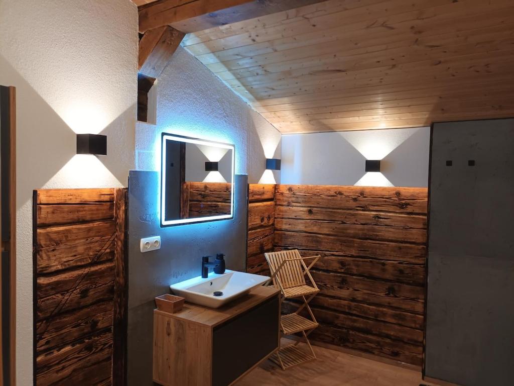 a bathroom with a sink and a mirror at Fewo zum schwarzen Hirsch in Dalaas